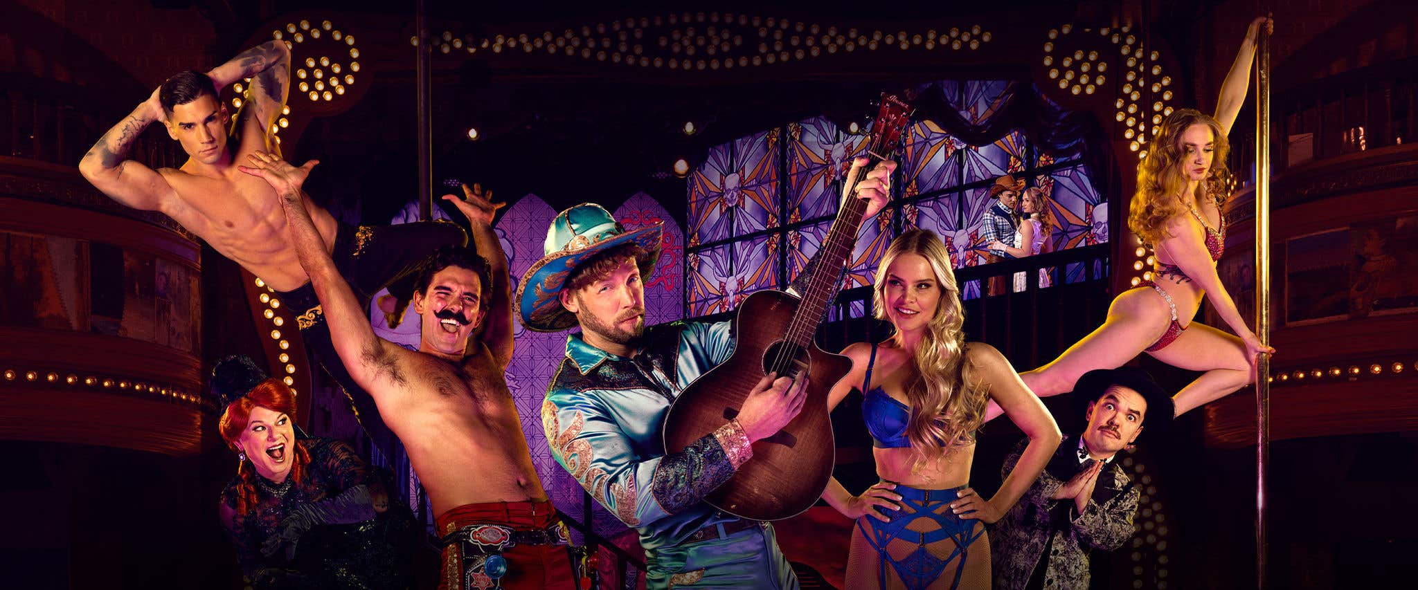 The Atomic Saloon Show talents in front of the stage set as background posing how they would perform during the show. 