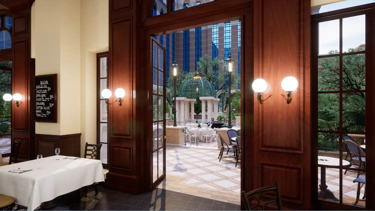 Elegant restaurant interior with wooden paneling, white tablecloths, and an open view to an outdoor dining area with a gazebo.