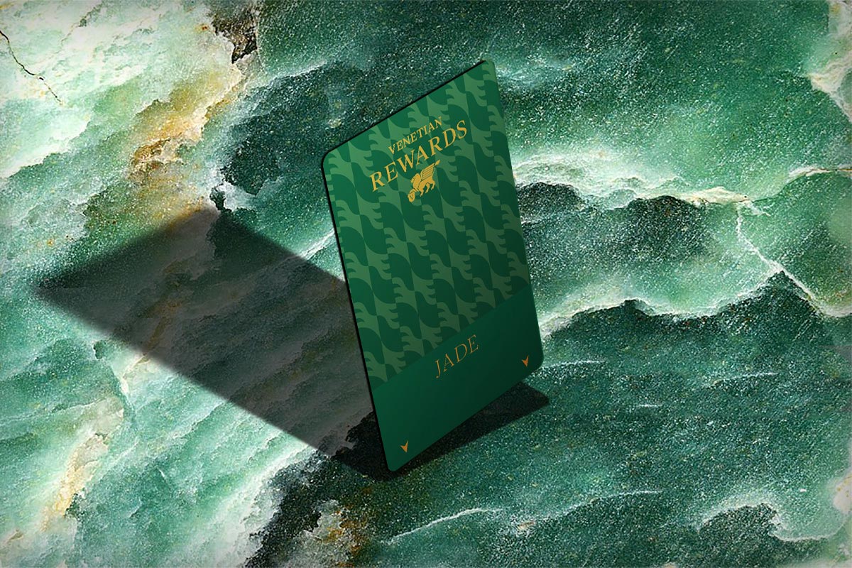 A Venetian Rewards Jade card against a green background